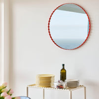 HAY Arcs Round Red Mirror with scalloped edge.