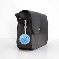 FIREFLY Baby Blue Reflective Pom Pom Bag Charm with Eyes