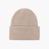The Stockholm Cashmere Hat in Sand  from LISA YANG is a classic rib knit beanie, framed by an oversized turn-up cuff. Made from premium soft and airy cashmere.  Unisex styling makes this a family favorite. Adjust the fold-over cuff to find your perfect fit.