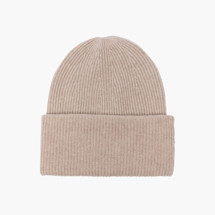 The Stockholm Cashmere Hat in Sand  from LISA YANG is a classic rib knit beanie, framed by an oversized turn-up cuff. Made from premium soft and airy cashmere.  Unisex styling makes this a family favorite. Adjust the fold-over cuff to find your perfect fit.