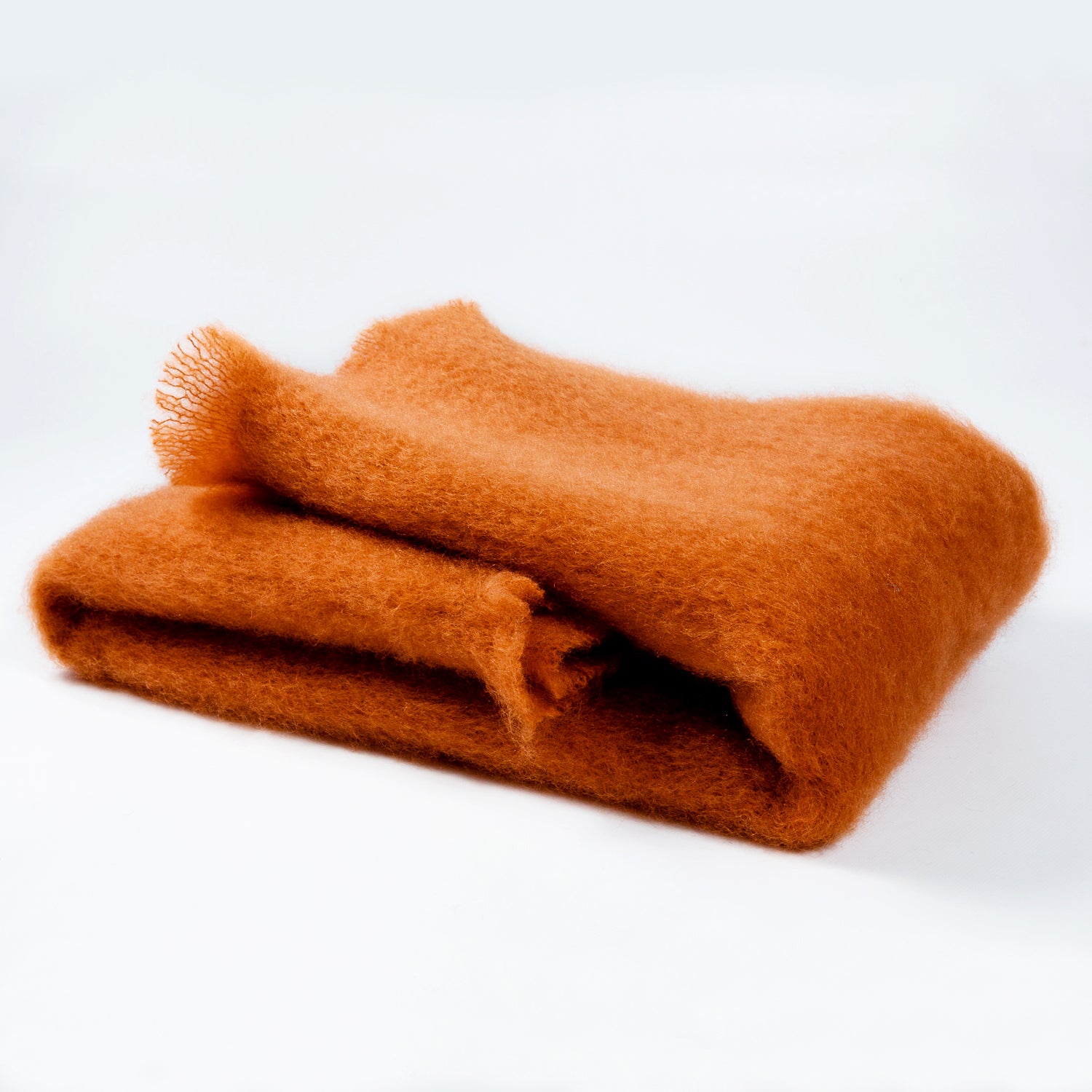The Lisos Mohair throws from Mantas Ezcaray are distinguished by their exceptional lightness and warmth. The shine and silkiness of the fibers allow for a bright and long-lasting colour. The plush mohair fabric used to make Mantas Ezcaray's signature 'Lisos' throw is regarded as one of the most luxurious natural fibers in the world. 