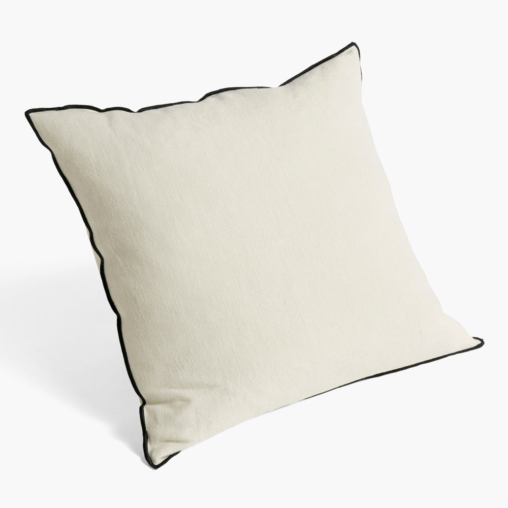 The chic Outline Cushion from HAY features a classic design with a contemporary colour twist. Made in a beautiful cotton-linen blend, the cushion has a contrasting piped trim around the edges to create a more defined silhouette. 