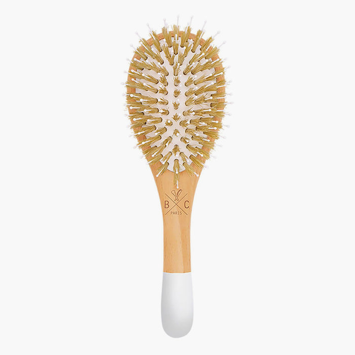 Gently detangle and smooth your locks with this beech wood brush from Bachca Paris. The brush is made with flexible pins and soft bristles that allow for thorough brushing without harmful pulling and tugging. 
