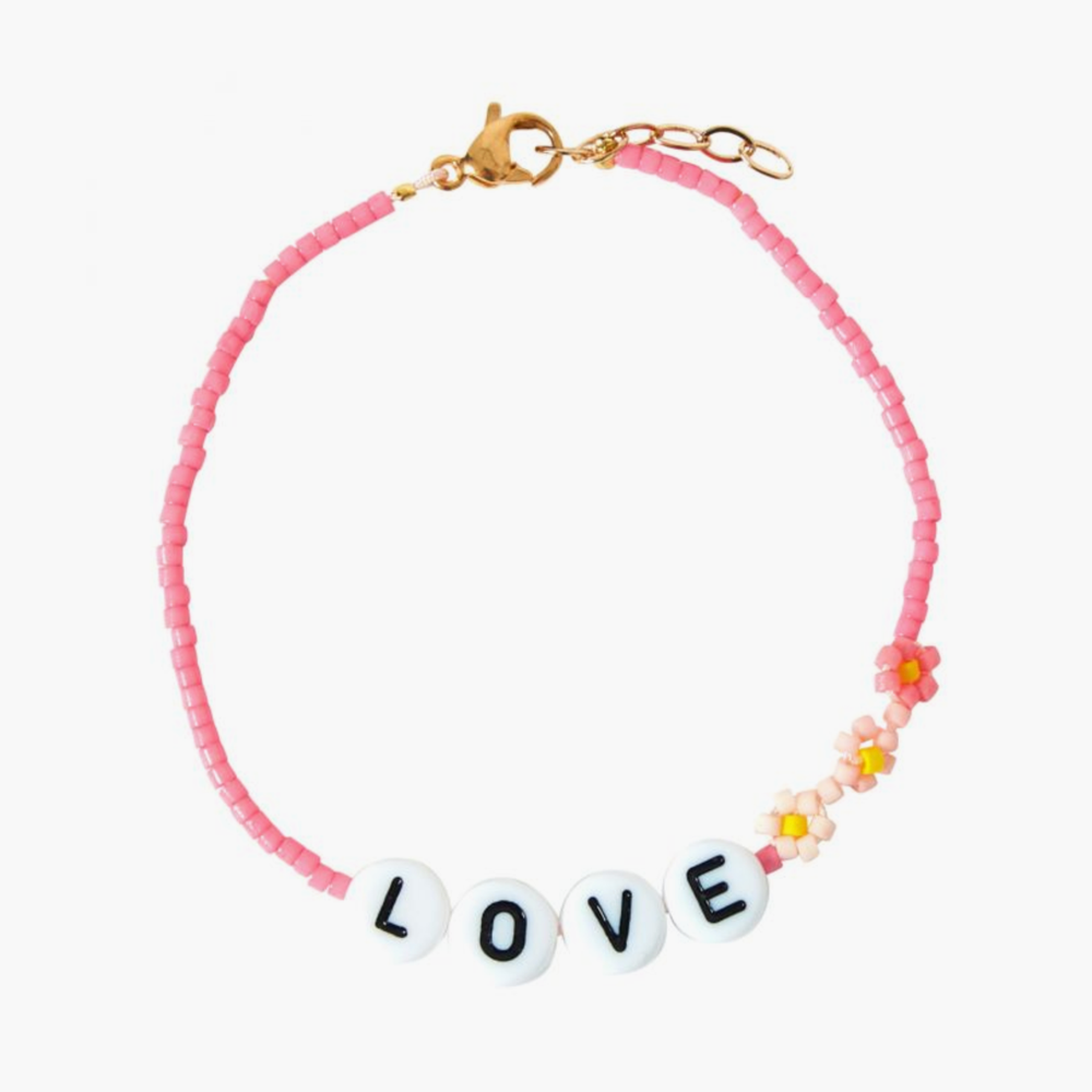 The LOVE Bracelet from French label Bbuble is a chic and colorful bracelet made from pink miyuki beads and white letter beads. Three small daisies in pink shades are nicely arranged around the LOVE beads.