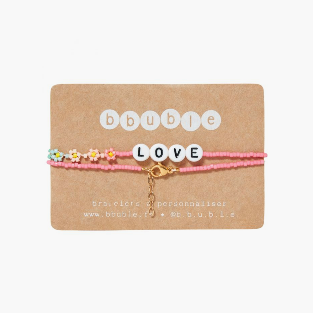 The LOVE Necklace from French label Bbuble is a chic and colorful necklace made from pink miyuki beads and white letter beads. Six small multi-color daisies are nicely arranged around the LOVE beads. All bracelets from Bbuble are handmade in their Parisian workshop. 