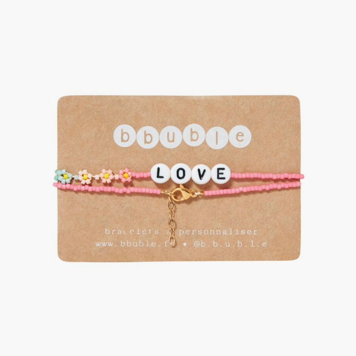 The LOVE Necklace from French label Bbuble is a chic and colorful necklace made from pink miyuki beads and white letter beads. Six small multi-color daisies are nicely arranged around the LOVE beads. All bracelets from Bbuble are handmade in their Parisian workshop. 