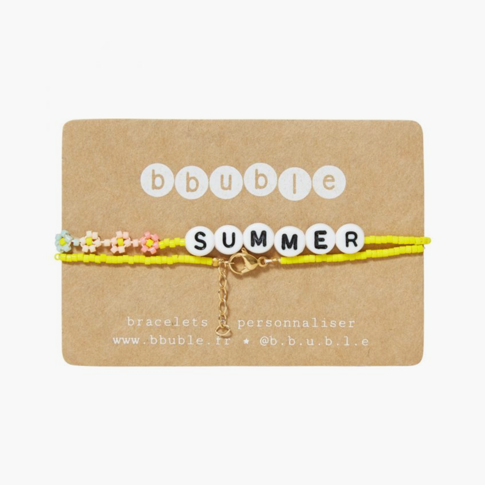 The SUMMER Necklace from French label Bbuble is a chic and colorful necklace made from yellow miyuki beads and white letter beads. Six small multi-color daisies are nicely arranged around the SUMMER beads. All bracelets from Bbuble are handmade in their Parisian workshop. 