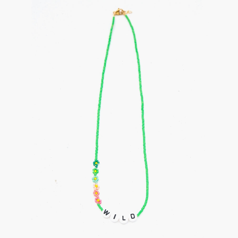 The WILD Necklace from French label Bbuble is a chic and colorful necklace made from grass green miyuki beads and white letter beads. Six small multi-color daisies are nicely arranged around the WILD beads. All bracelets from Bbuble are handmade in their Parisian workshop. 