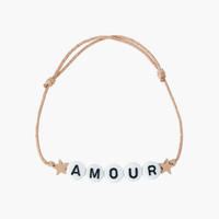 The AMOUR Charm Bracelet from French label Bbuble is a chic and simplistic cord bracelet composed of white letter beads, two rose gold stars on a sparkly cord.  All bracelets from Bbuble are handmade in their Parisian workshop. 